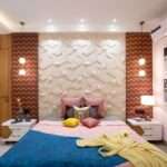 Modern bedroom wall design in Vizag featuring wooden fluted wall panels, upholstered headboard, LED lighting, luxury bed, and elegant bedroom interiors by SpaceHeaven Interior.