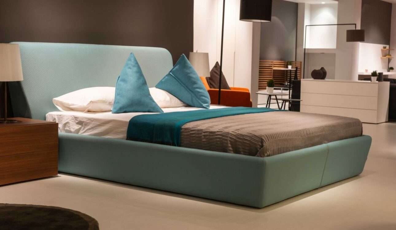 Modern bedroom designs featuring a luxury bed, custom wardrobe, elegant lighting, wooden wall panels, and premium bedroom interior design in Vizag.