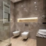 Modern bathroom designs in Vizag with contemporary tiles, vanity and walk-in shower