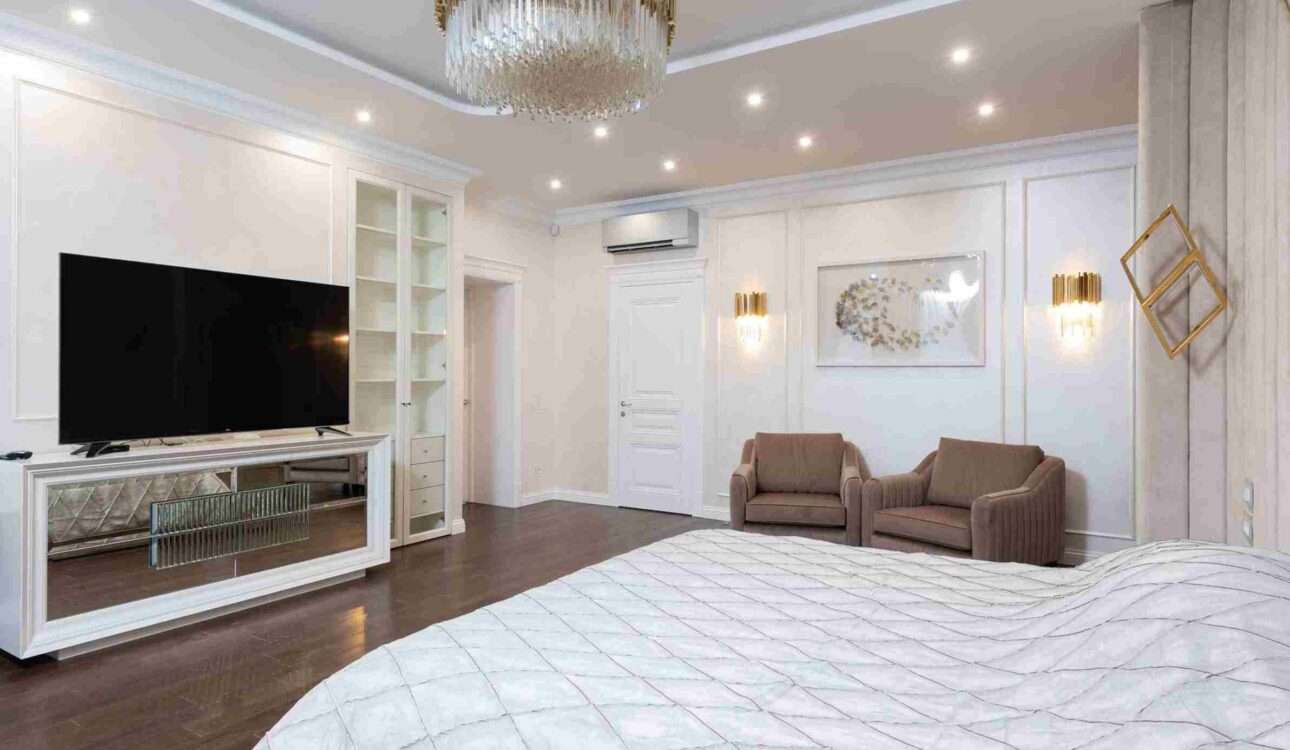 Modern bedroom ceiling design in Vizag with recessed lighting and elegant false ceiling